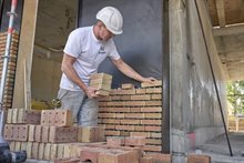 Bouwmedewerkers gebruikt Drystack droog stapel systeem